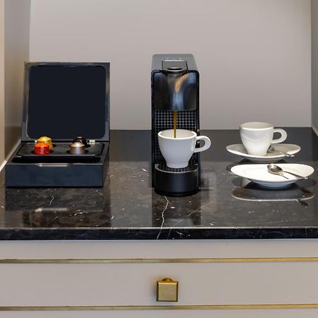 Melia Vinpearl Hue Hotel Kültér fotó A Nespresso coffee machine in a hotel room