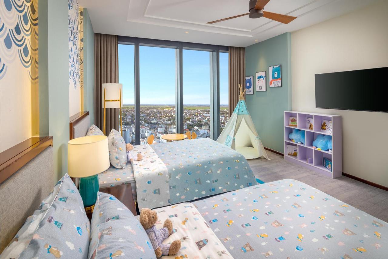Melia Vinpearl Hue Hotel Kültér fotó A bedroom at the Atlantis Paradise Island